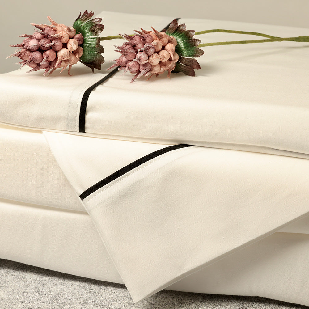 natural and black bed sheets